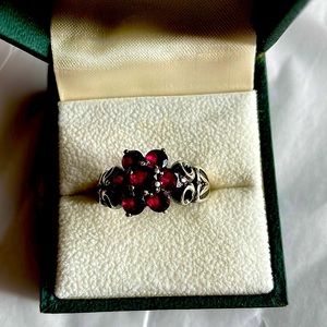 Silver ring with rhodolite garnets.